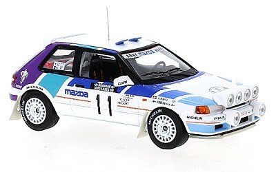 MAZDA 323 GTX No.11 M. MIKKOLA / A. HERTZ RALLYE 1000 LAKES 1990 WITH NIGHT LIGHTS